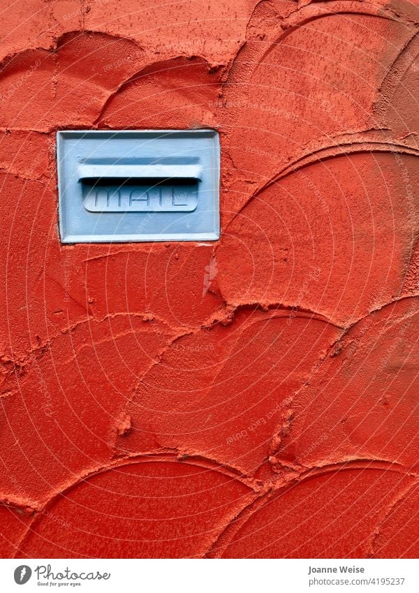Blue mailbox in red stucco wall. Wall (barrier) Mailbox letterbox red wall Red Colour photo Exterior shot Letter (Mail) Fence Communicate Write