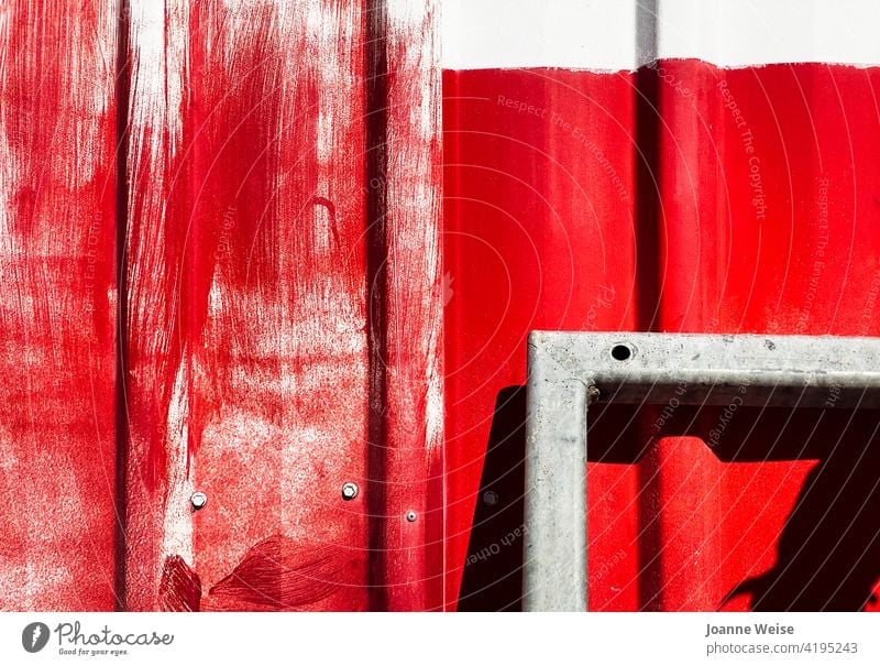 White wall with bright red paint and metal frame. Red Wall (building) Colour photo Exterior shot Day Building Bright Colours Metal Brush strokes sunny day