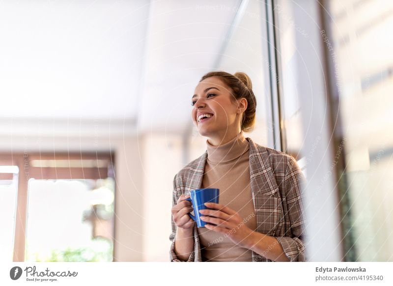 Smiling  business woman having coffee break in office kitchen girl people Entrepreneur businesswoman successful professional young adult female lifestyle