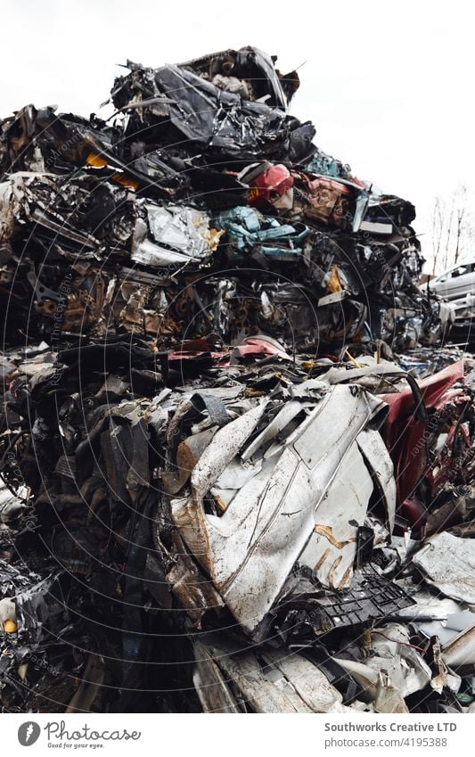 Scrapped Cars Crushed In Vehicle Recycling Centre car crushed crusher accident wreck crash loss adjuster insurance claim auto right off written off recycling