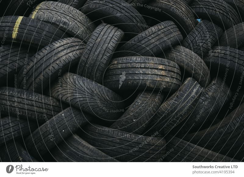 Full Frame Close Up Of Tyres From Scrapped Cars In Vehicle Recycling Centre tyre tire car accident wreck crash loss adjuster insurance claim auto right off