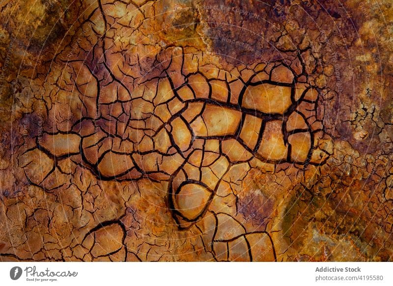 Dry cracked ground in nature earth background dry arid surface texture badland rough minas de rio tinto spain andalusia uneven abstract barren wild desolate