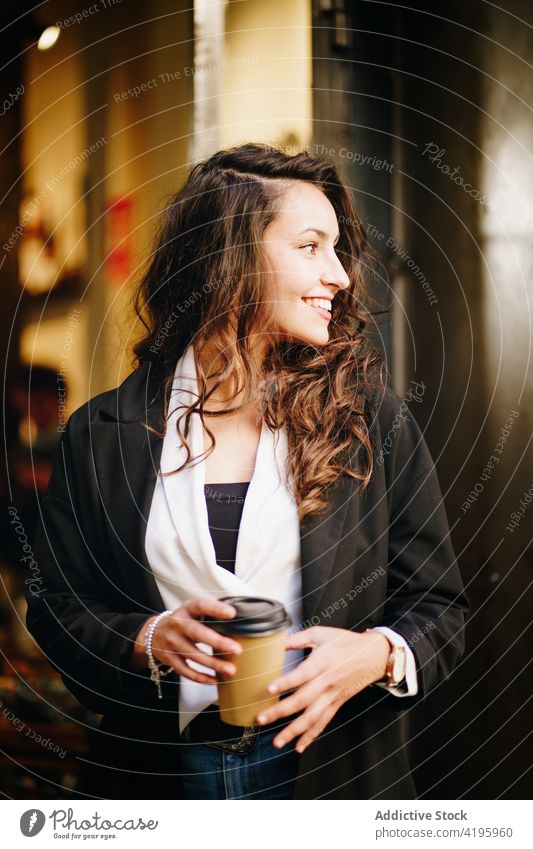 Stylish businesswoman with takeaway coffee city entrepreneur to go drink female style smart casual positive urban beverage smile paper cup street cheerful