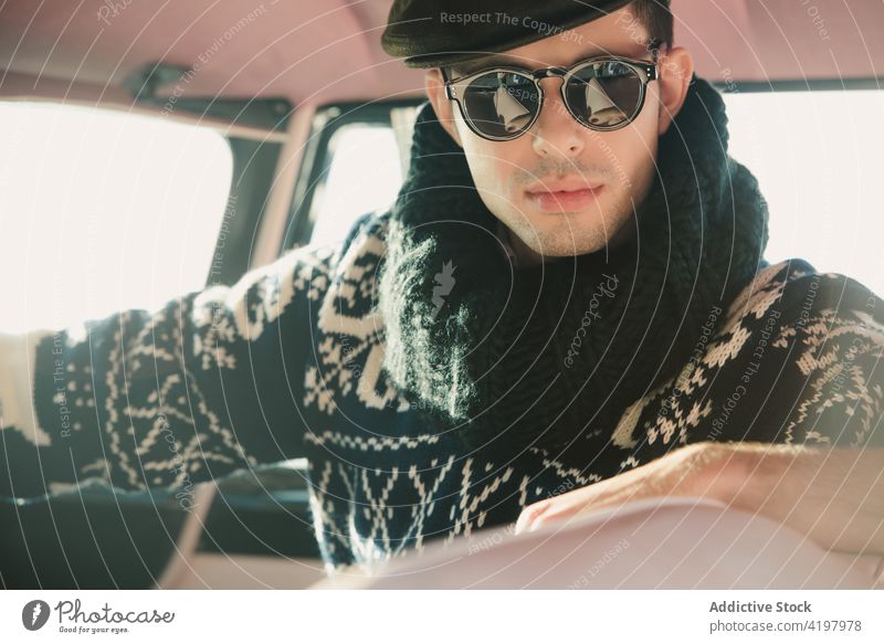 Crop trendy man in sunglasses and knitwear in vehicle model fashion style retro ornament portrait soft sweater 50s bright vintage stylish knitted masculine