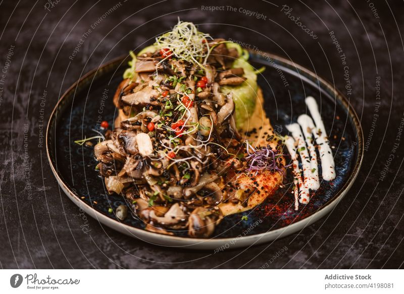 Tasty zucchini nest with assorted mushrooms on plate asian food vegetarian meal dinner menu lunch spaghetti sauteed sweet potato alioli alfalfa sprout red berry