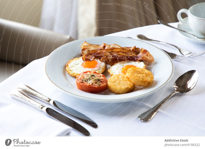 Tasty breakfast with fried eggs and coffee served on table in restaurant bacon mozzarella tomato tasty nutrition gastronomy meal yummy dish cuisine crispy