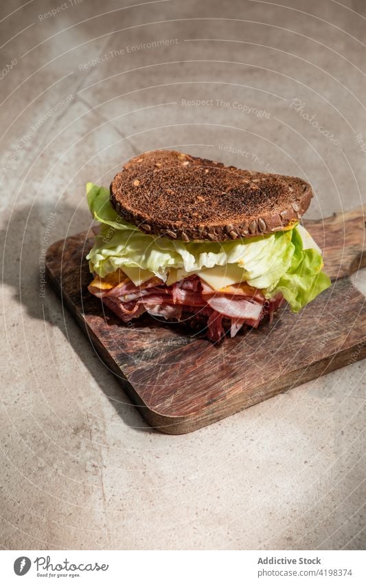 Healthy sandwich with salad leaves and bacon lettuce bread crunch toast appetizing board wooden nutrition restaurant yummy culinary tasty crispy nutrient rye