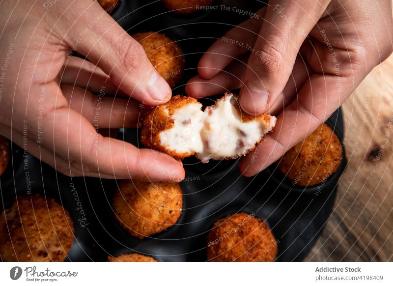 Cook showing freshly fried cheese ball in restaurant chef crunch yummy roast crispy deep fried culinary appetizing cook tasty food kitchen prepare nutrition