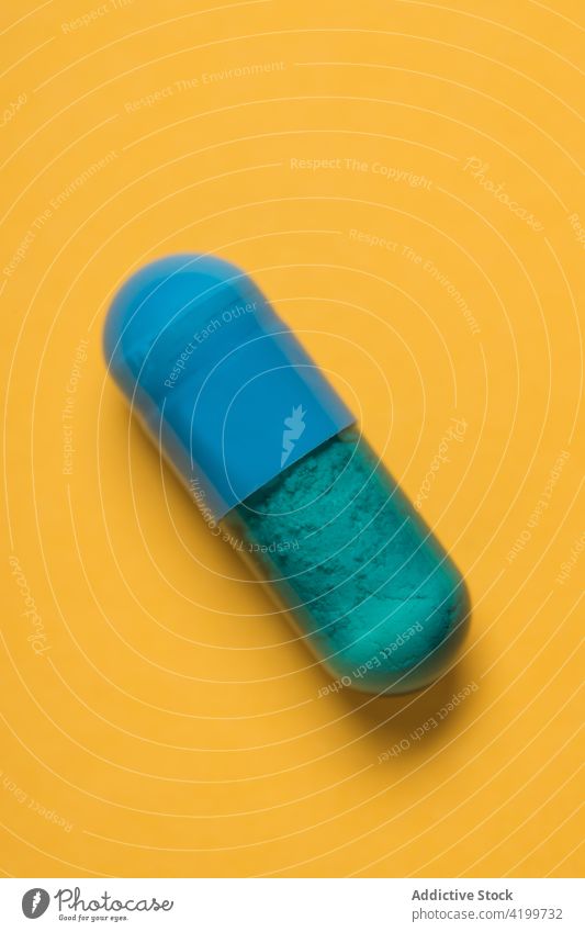 Plastic capsule of medical drug for treatment medication pharmaceutical care dose heal prescription concept chemistry studio shot colorful chemical health care