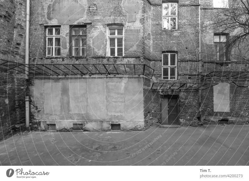 an old backyard in the old town of Warsaw Backyard b/w Black & white photo Poland Town Old town Architecture Exterior shot Deserted Downtown Day Window
