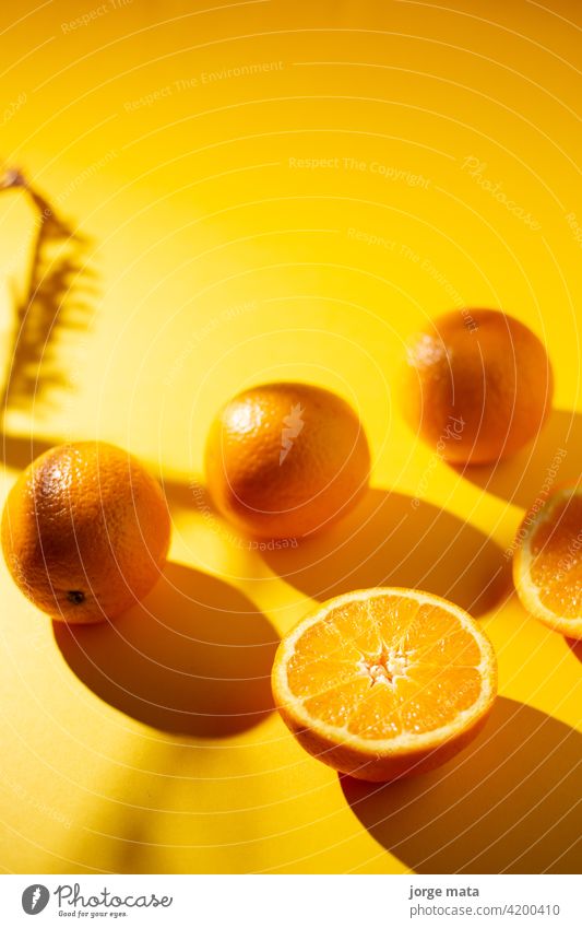 oranges in spring with yellow background food fruit freshness juicy vitamin pulp colours nourishment citric fruity refreshment tropical organic fruit stand