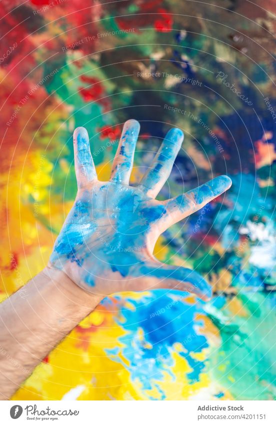 Painter showing dirty hands painter messy art outstretch bright colorful artist palm vivid blot demonstrate aquarelle blue shape watercolor body part