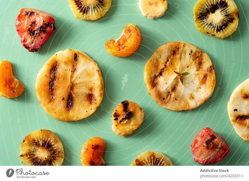 Grille fruit pattern apple banana barbecue dessert eating food green grilled healthy kiwi mix orange pieces strawberry summer sweet tangerine tropical variety