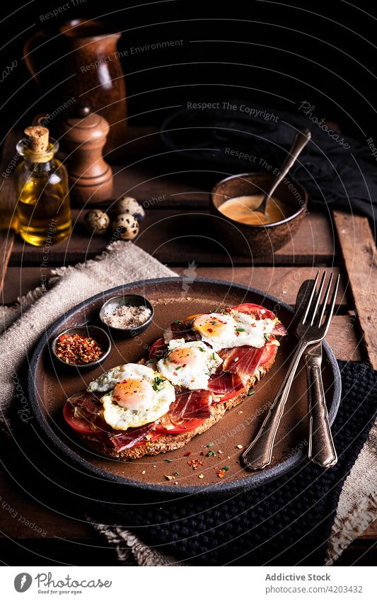 Toast with fried eggs and ham breakfast toast prosciutto bread food rustic meal cuisine appetizing italian quail delicious tasty nutrition serve eat dish
