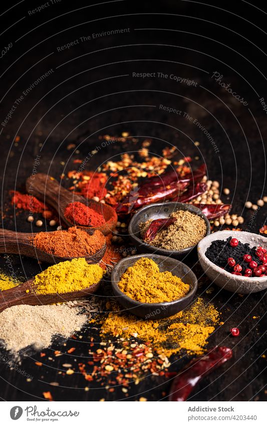 Set of various types of spices on table set condiment seasoning colorful aromatic assorted food ingredient cuisine organic bowl spoon culinary natural pepper