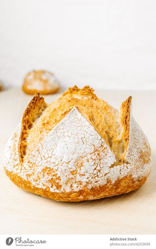 Appetizing bread with crunchy crust on table fresh natural product baked scent flour bakery delicious aroma appetizing shape round tasty wheat golden surface