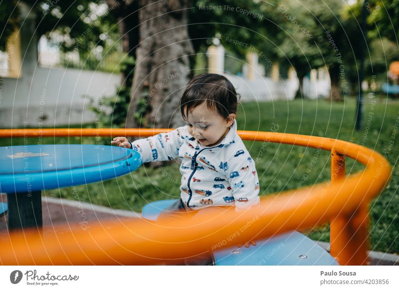 Child playing in the park 1 - 3 years Caucasian having fun Playground playground equipment Infancy Exterior shot Human being Colour photo Toddler