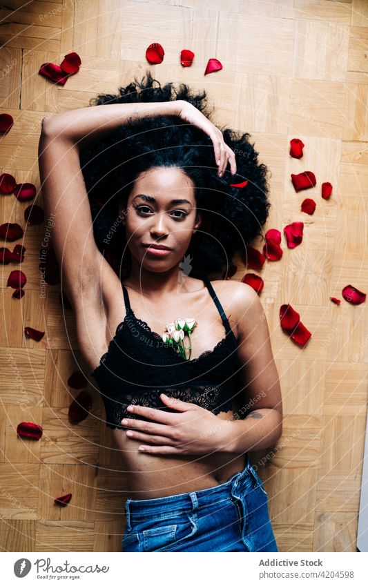 Ethnic woman with rose flowers romantic bunch tender valentine petal floral delicate female ethnic hairstyle afro black african american charming curly hair