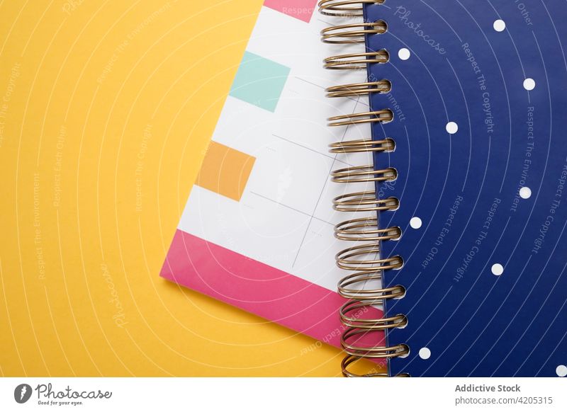 Colorful planner and notebook on table calendar agenda diary schedule business concept supply color multicolored spiral stationery office colorful organizer