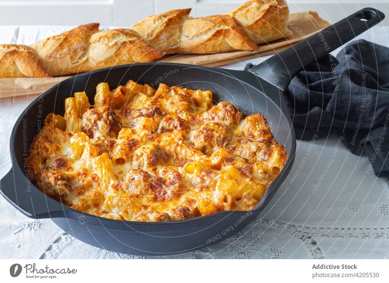 Delicious homemade gratin pasta with meatballs and cheese baked macaroni food culinary delicious sauce appetizing skillet pan meal cuisine tasty nutrition