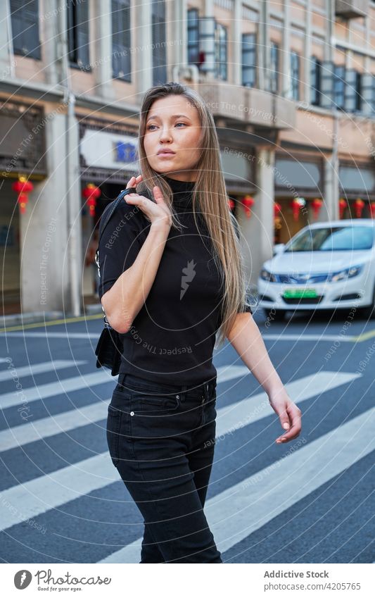 Young girl walking around Chinese downtown woman Chinatown urban Asia Russian girl alone beautiful blond blue eyes city city life cityscape day elegant female