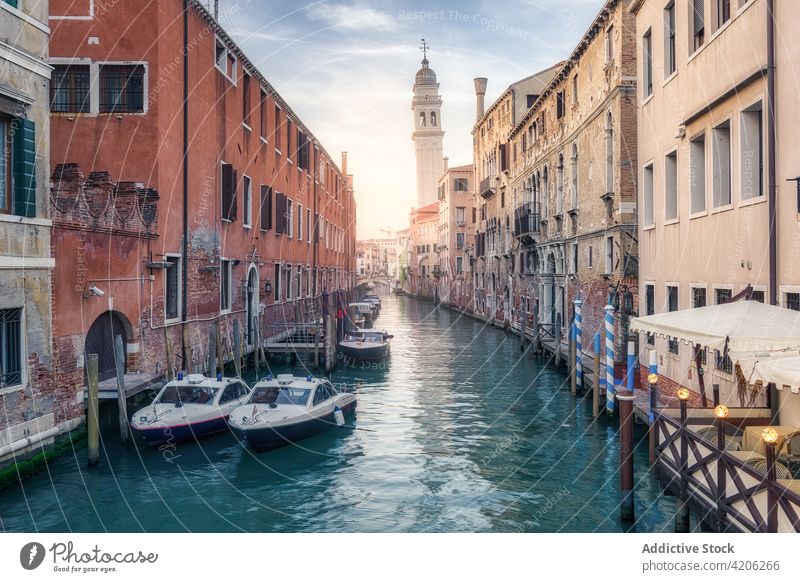 Water canal with boats near old buildings water city channel moor vessel sunset residential venice italy shabby exterior architecture scenery town sundown