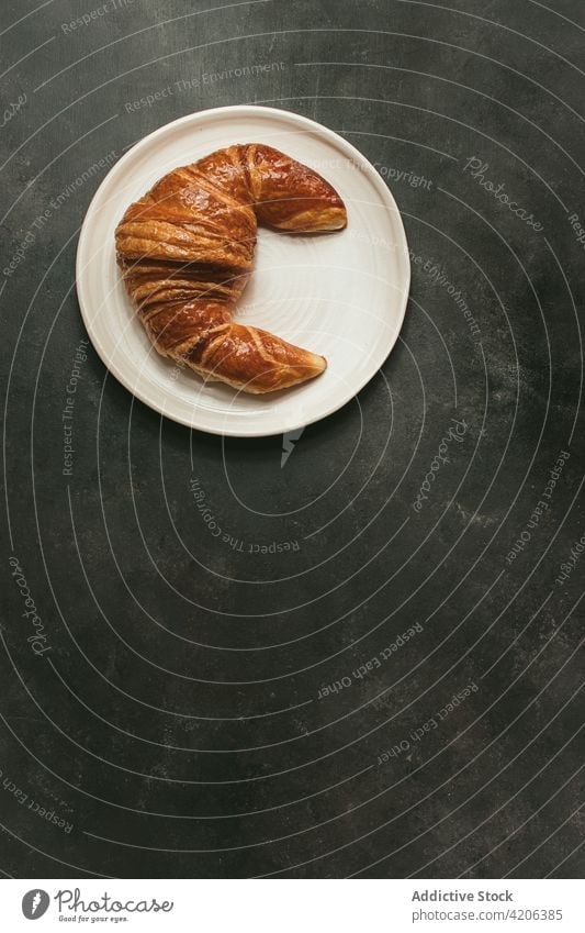 Baked croissant on plate on table baked bread set food fresh bakery bun pastry breakfast shape cuisine nutrition crust rustic culinary delicious product meal