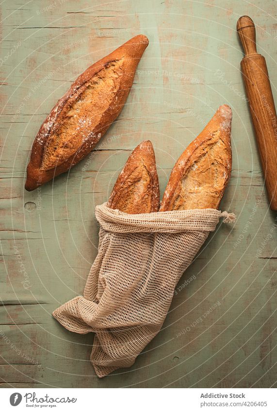 Fresh bread in burlap sacs loaf sack bag baked rustic food set baguette fresh aromatic bakery natural cuisine nutrition crust culinary delicious product meal