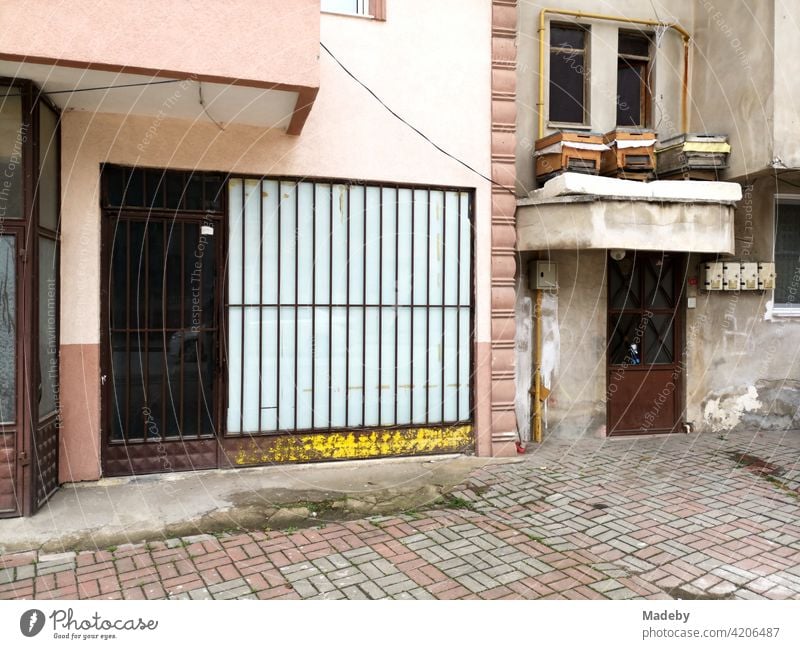 Closed shop with bars in front of the window in the streets of Adapazari in the province of Sakarya in Turkey business door Window Entrance Shop window