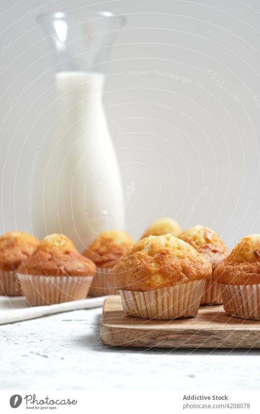 Sweet muffins and jar of milk pastry homemade sweet fresh breakfast baked dessert food yummy tasty appetizing cuisine gastronomy treat meal culinary product