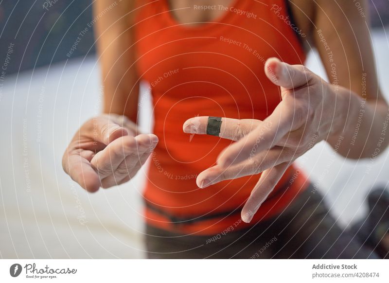 Crop woman showing hands in chalk demonstrate training blood prepare athlete gym physical female pain alpinism healthy sport strength vitality strong wellness