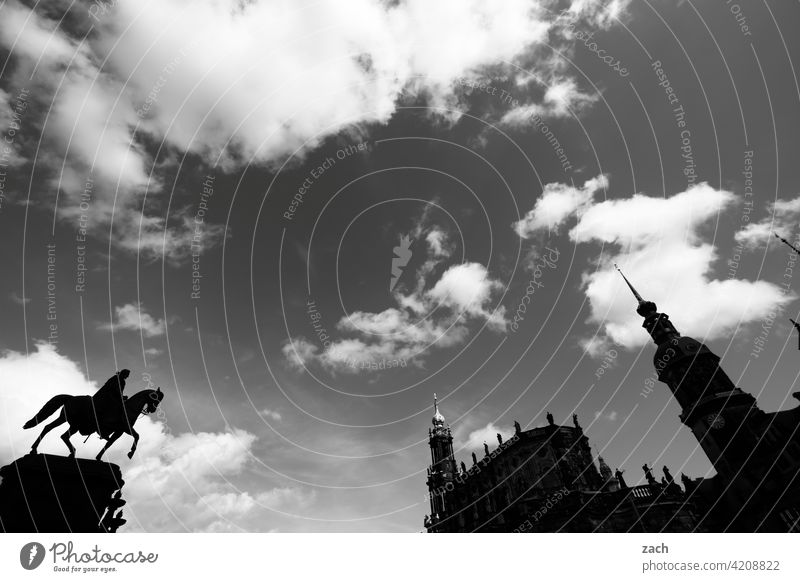 Dresden in silhouette Dresden Old Town Saxony Ride Rider Equestrian statue Old town Tower Lock Church Church spire Black & white photo Sky Clouds