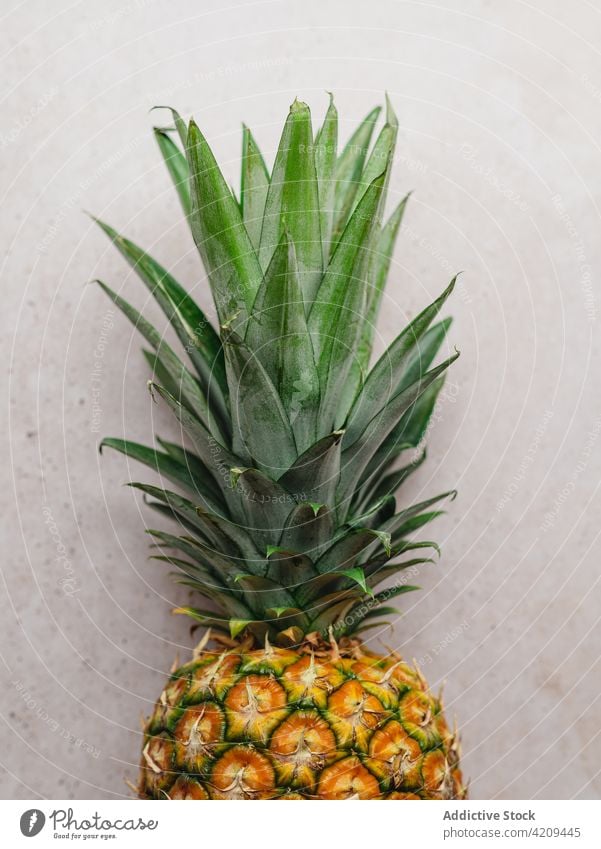 Fresh pineapple placed on table whole tropical fruit season exotic sweet tasty ripe kitchen fresh organic vitamin delicious natural appetizing nutrition healthy