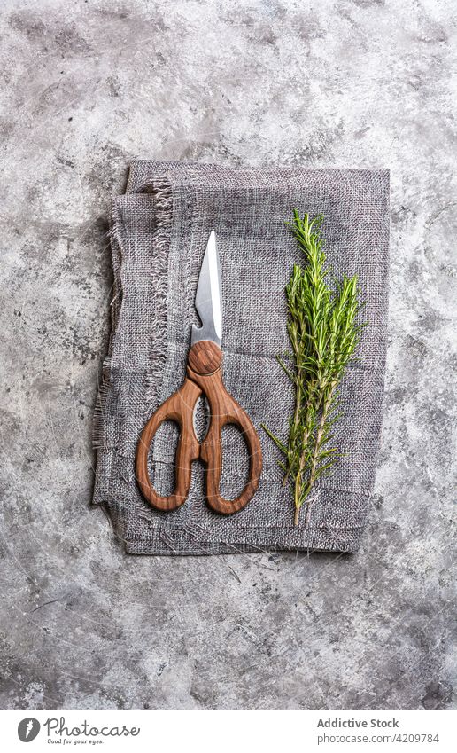 Rosemary twigs and scented organic oil on table herb rosemary candle scissors textile decor ingredient essential cloth light fragrant creative bright surface