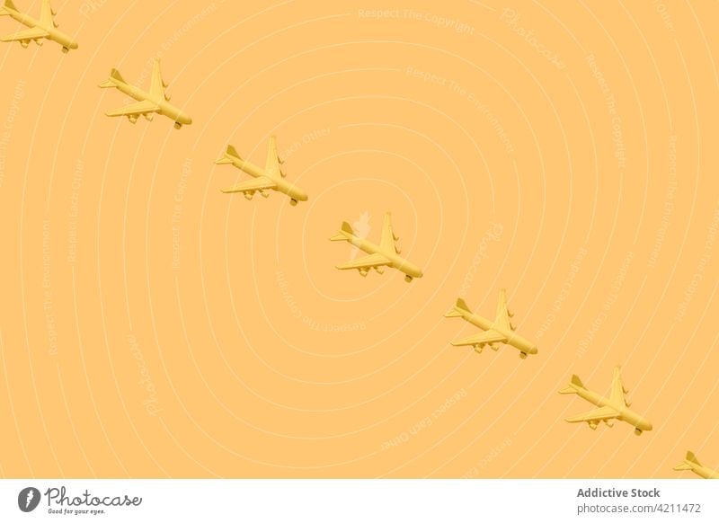 Yellow airplanes placed against yellow background aircraft object concept minimal set creative collection decorative many little studio advertise vivid colorful