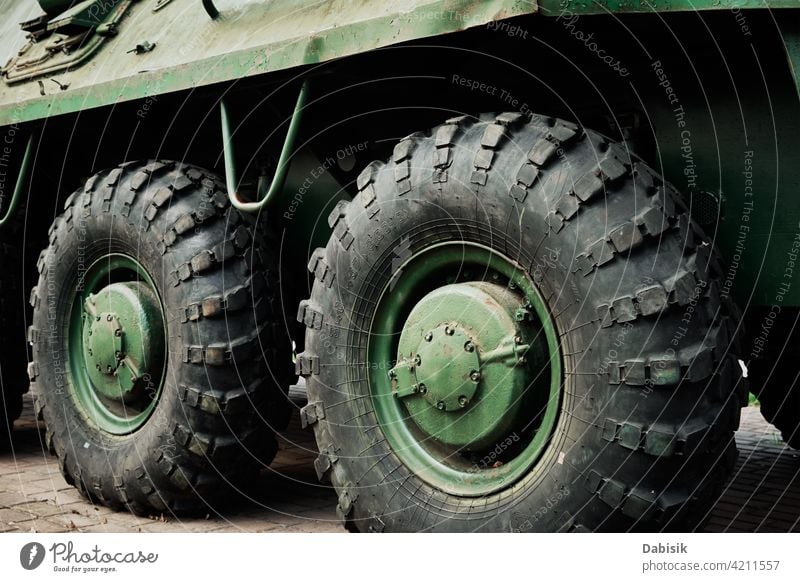 Armored car detail armored car military war wheel tire transport tread threat danger jeep dirt spikes fight close up part machine transportation technology