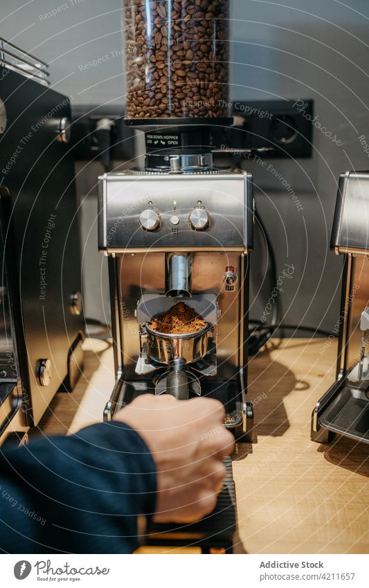 Barista making coffee in cafe barista grinder aromatic fresh prepare professional caffeine drink work job cafeteria occupation equipment coffee shop delicious