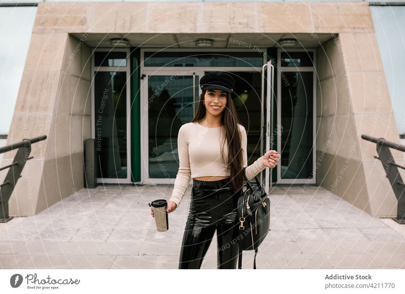 Stylish businesswoman standing neat modern building trendy outfit city entrepreneur style contemporary urban entrance female street slim slender well dressed