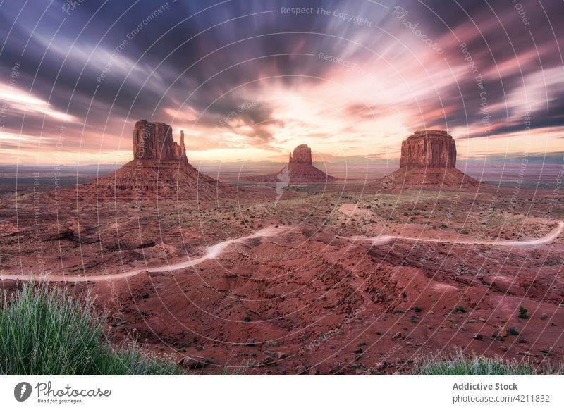 Picturesque landscape with rocky formations under colorful sky valley nature environment picturesque scenery monument valley america usa spectacular terrain