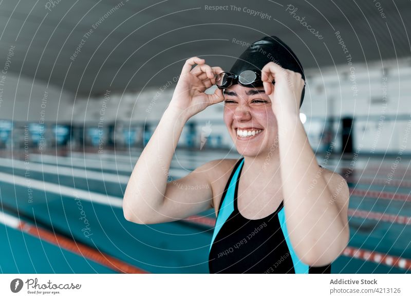 Swimmer ready to swim sport water swimmer female woman pool athlete young swimwear training blue people cap competition person lifestyle healthy one caucasian