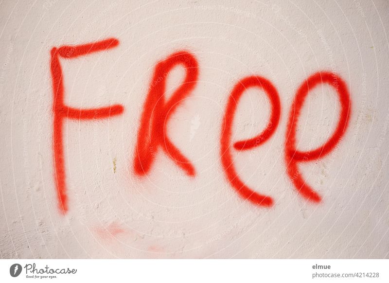 FREE was sprayed in red on a wall / free Free Graffito Wall (building) free of charge Red munificent unfasten Free-of-charge Freedom of speech give free rein