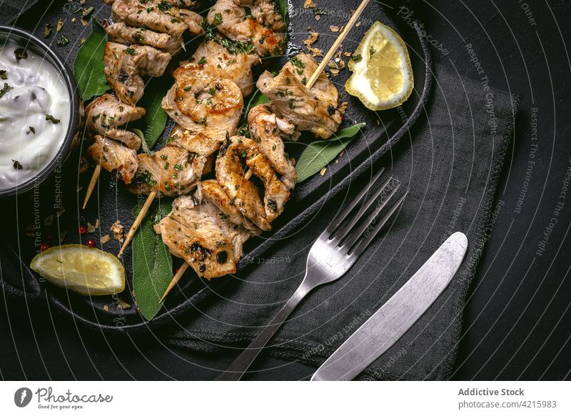 Tasty meat on skewers on tray dish appetizing serve piece tasty sauce food meal delicious cuisine gourmet ingredient cook bowl gastronomy culinary nutrition