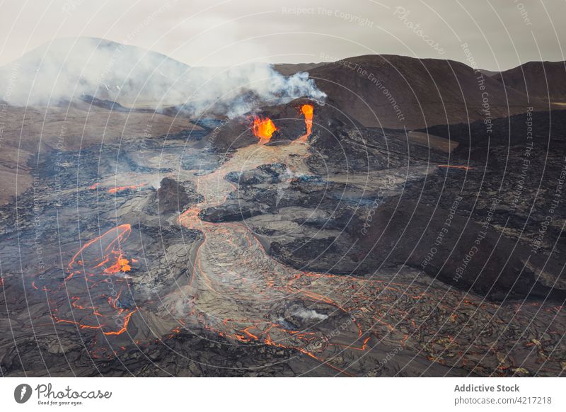 Fagradalsfjall volcano erupting in Iceland iceland lava magma smoke mountain red hot nature volcanic eruption crater active danger geology explosion fog fire
