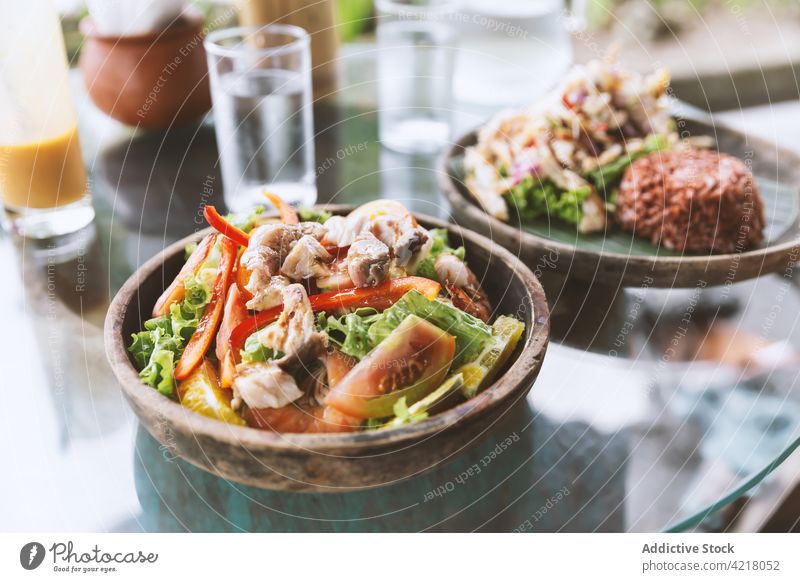 Appetizing chicken and vegetables salad served on glass table dish delicious meal tasty appetizer lunch cuisine healthy food nutrition yummy fresh portion