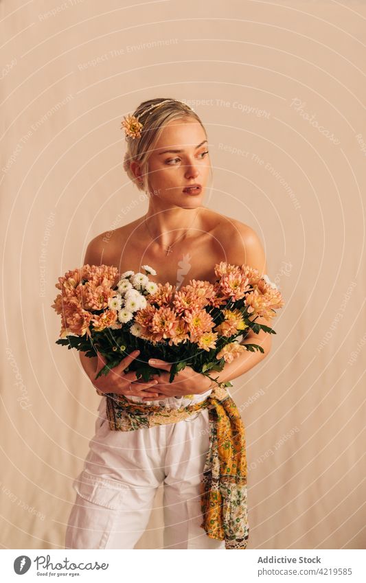 Tender young woman with bouquet of flowers romantic tender feminine delicate gentle portrait floral female beauty style bare shoulders charming beautiful bloom
