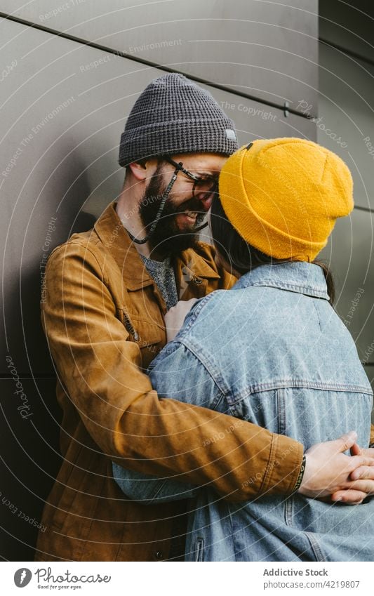 Tender couple embracing on terrace near wooden building hug style hipster young embrace love trendy outfit romantic together affection house girlfriend fondness