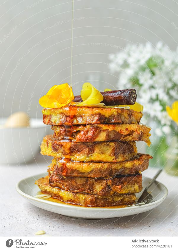 Tasty French toasts with honey on plate french toast pile breakfast pour sweet dessert treat morning table food meal delicious tasty serve add yummy gourmet