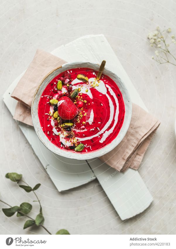 Delicious cold berry soup in bowl on table dessert sweet red serve treat food cuisine tasty meal gourmet dish fresh nutrition pistachio garnish delicious yummy
