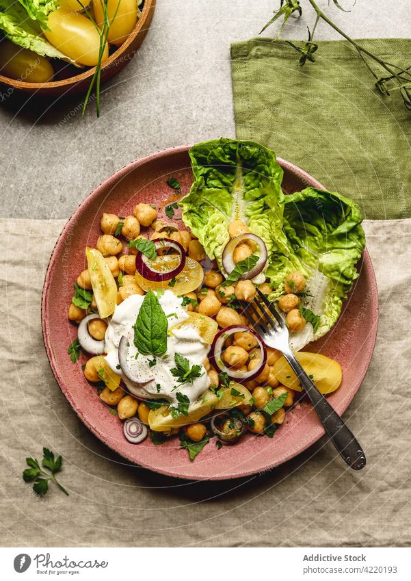 Tasty chickpea with cheese and vegetables on plate dish burrata appetizing serve food delicious cuisine meal tasty gourmet mozzarella onion yellow tomato