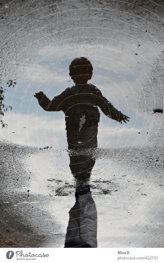 Puddle-diego Playing Children's game Human being Toddler 1 1 - 3 years 3 - 8 years Infancy Water Autumn Weather Bad weather Storm Rain Laughter Walking Dark Wet